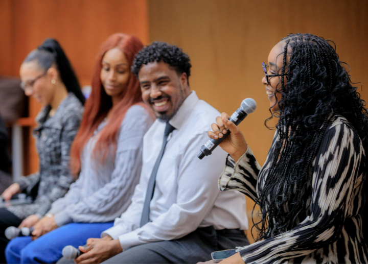 Three people speaking on a panel during Black History Month 2025
