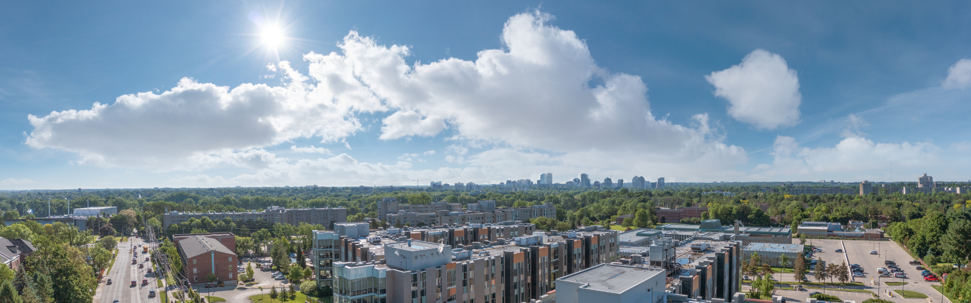 An aerial shot of the campus, with university buildings and trees.