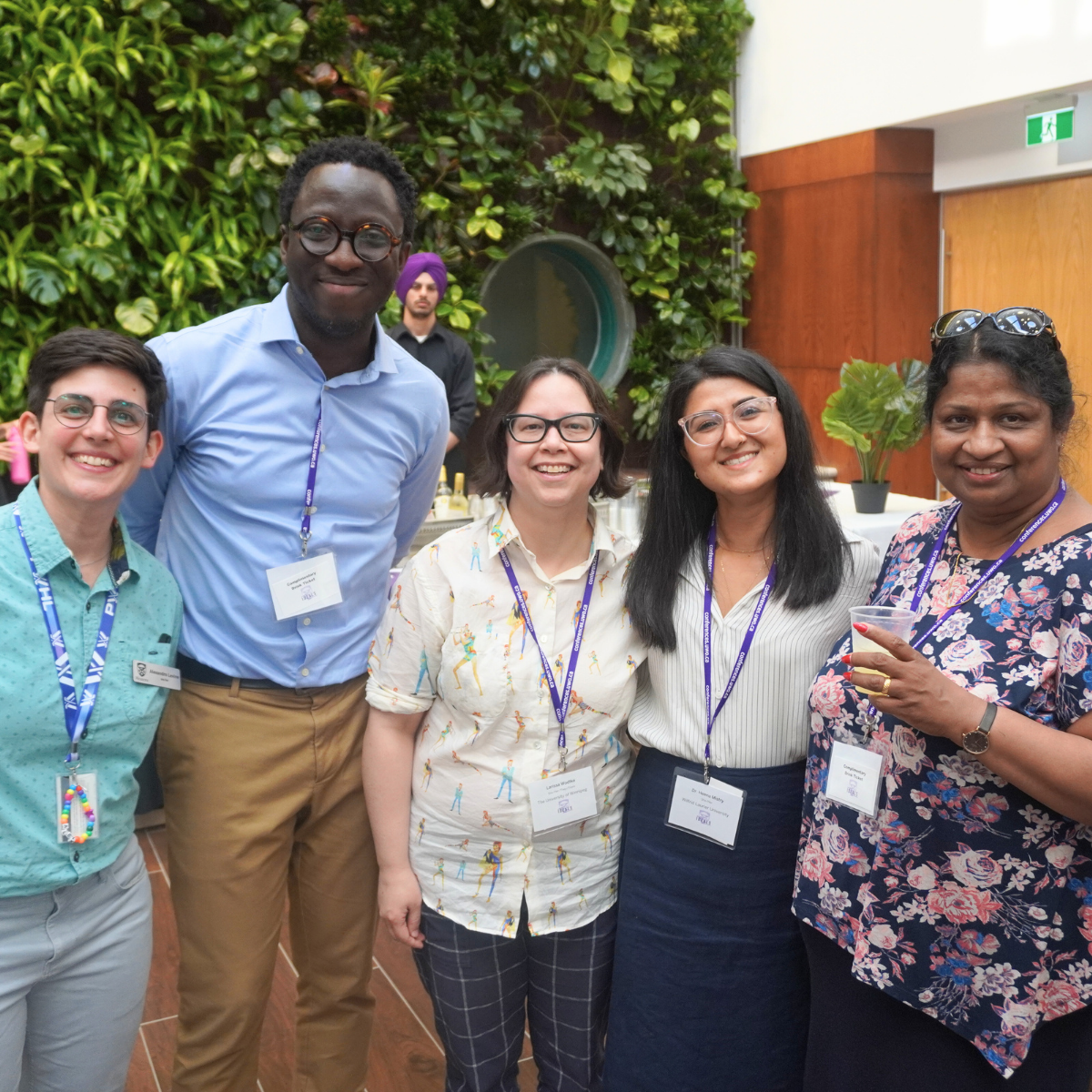 An image of five people smiling for the camera at the ID2EALS conference